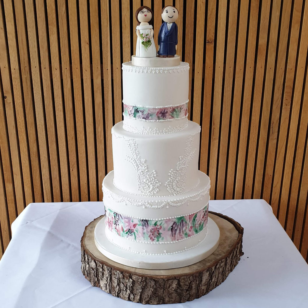 Hand painted and royal iced lace wedding cake 
