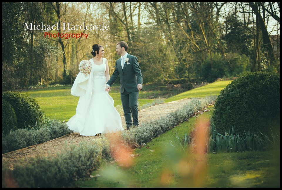 Bride and groom outside in gardens