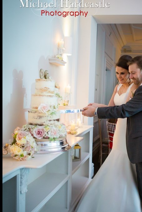 Bride and groom cutting the cake