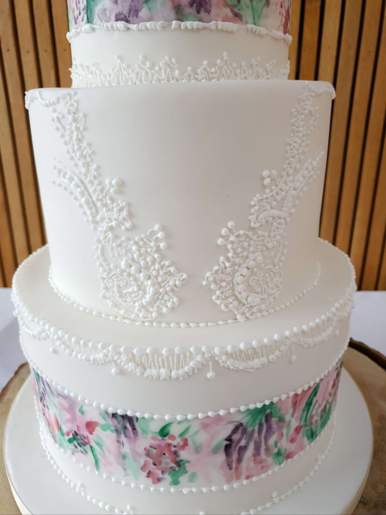 Hand piped royal icing lace