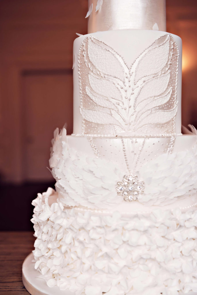 Photograph of handpiped royal icing tutu bodice and sugar feather headdress