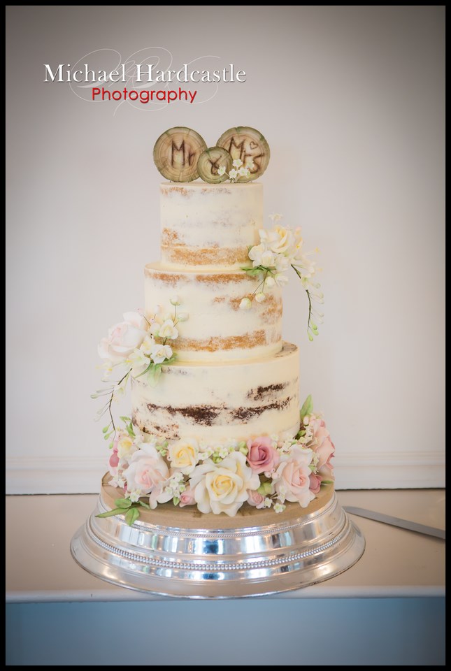 Semi naked wedding cake with sugar flowers
