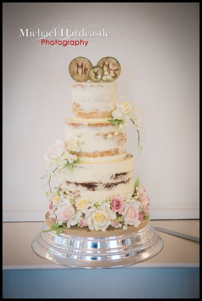 Semi naked wedding cake with sugar flowers