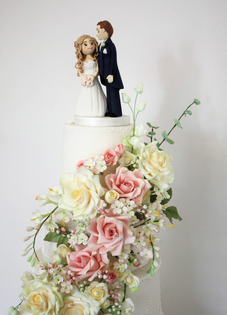 Sugar flower wedding cake with handmade couples topper