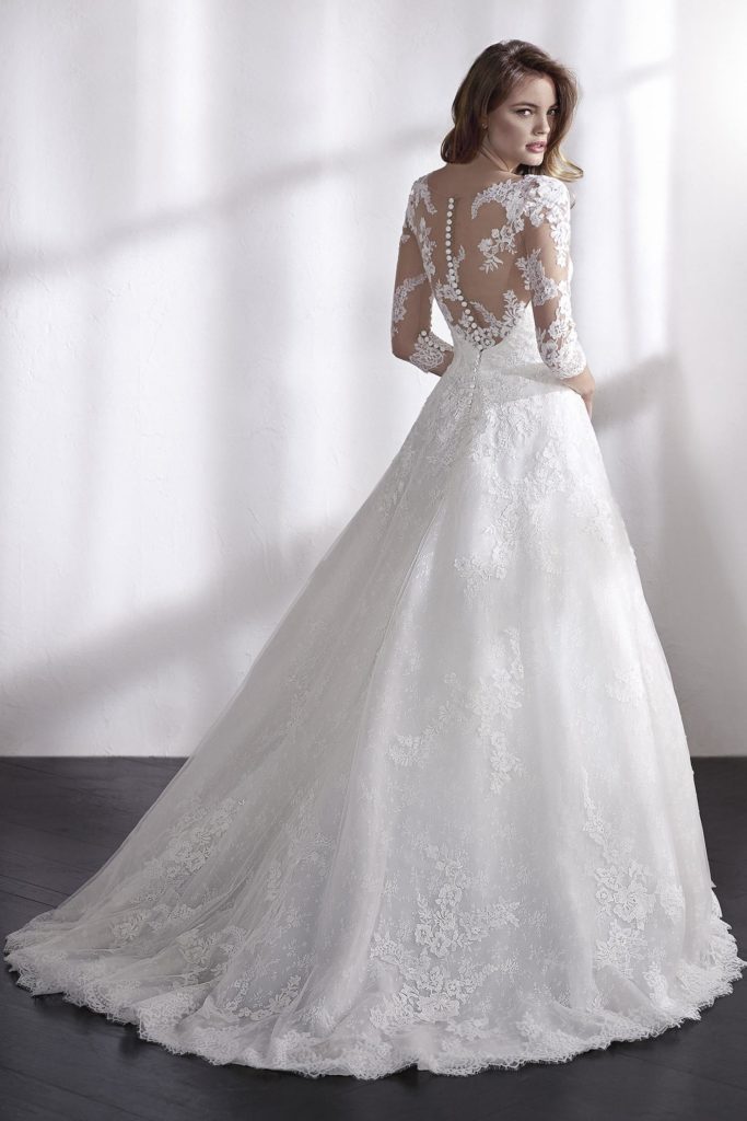 Bride in lace wedding dress with illusion back