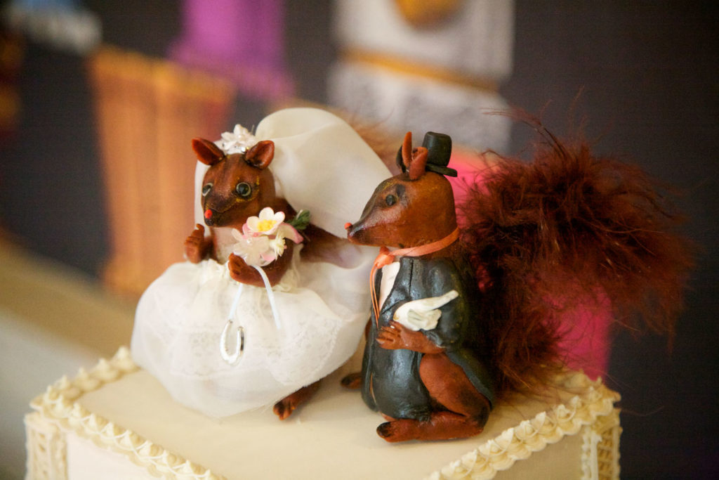 Handmade marzipan squirrel wedding cake topper