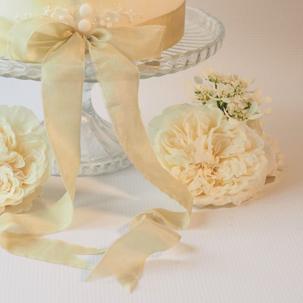 Beautiful silk ribbon trim on wedding cake