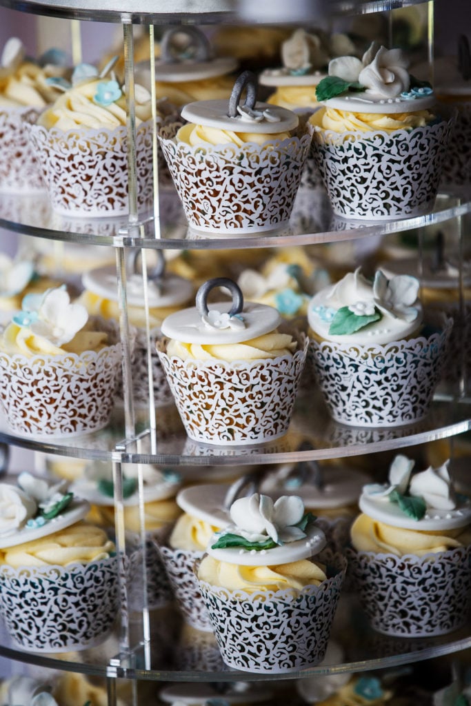 wedding cupcakes with laser cut cases handmade fondant toppers with wedding rings and sugar flowers