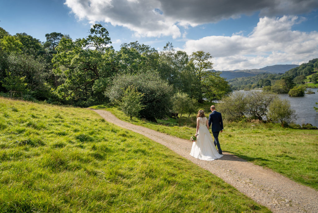 Portrait shot of bride and groom by the lake