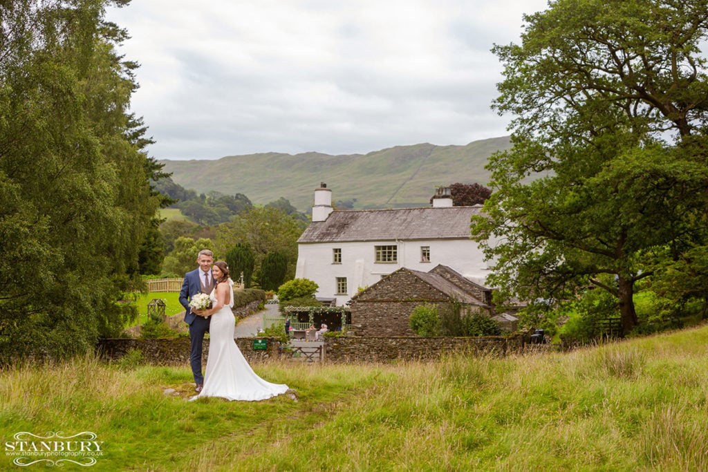 Bride and groom portrait with Cote How in the back ground