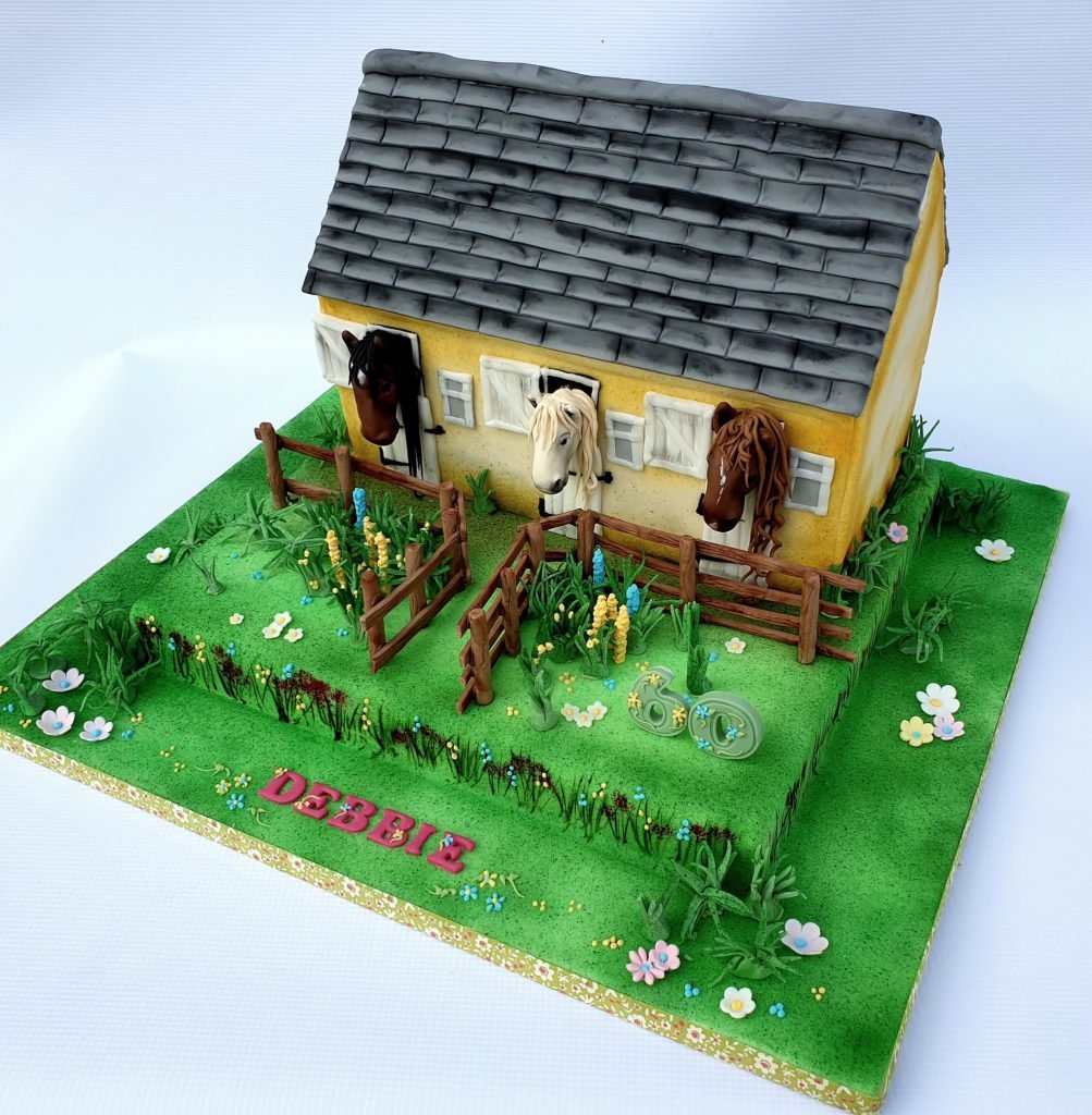 Carved Stable cake with gardens and sugar horses